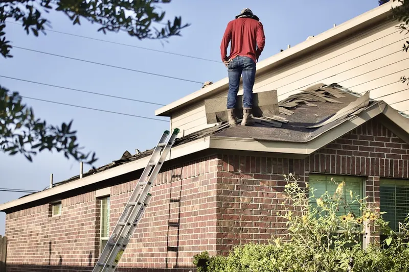 Professional roofer working on a residential roof in Rockville